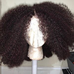 Kinky curly maroon colored wig .